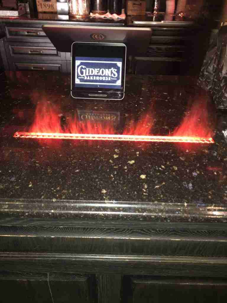 Red flames at Gideon's Bakehouse checkout counter