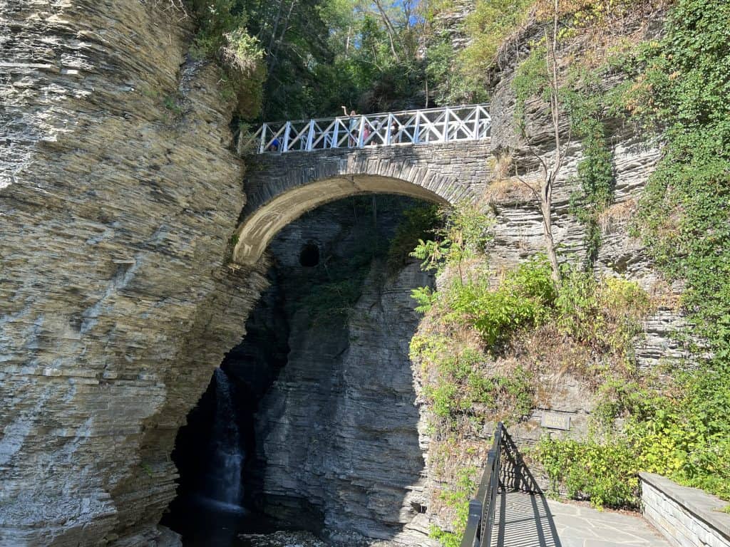 Julie waving from Sentry Bridge in Watkins Glen State Park