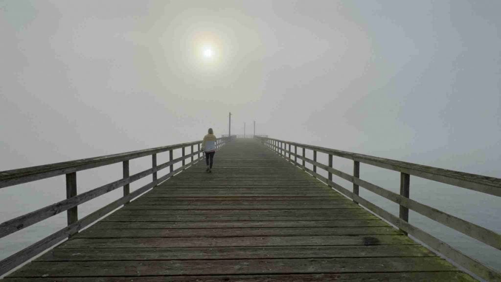 Foggy morning walk on boardwalk by Battery Point Lighthouse