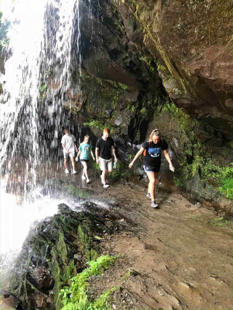 Hiking behind a waterfall in the Smoky Mountains