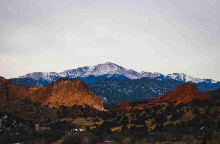 brown and green mountains under white sky during daytime