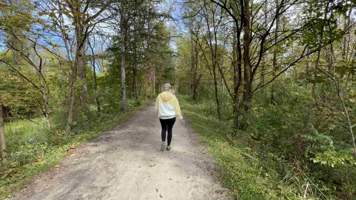 A woman walks the Towpath Trail in Cuyahoga Valley National Park