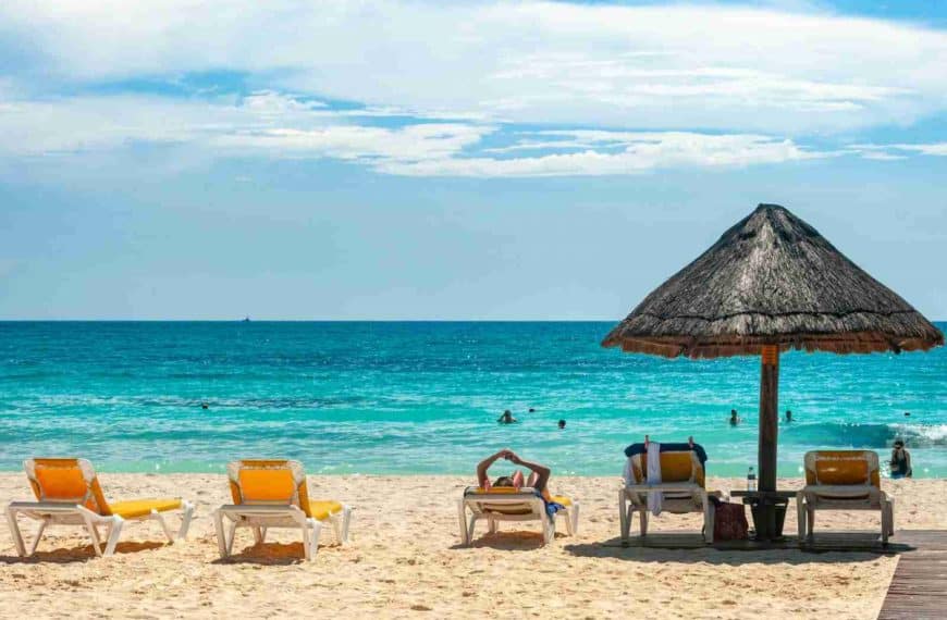 brown beach umbrellas on beach during daytime