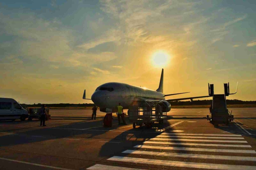 white airplane parked during daytime - Cancun International Airport