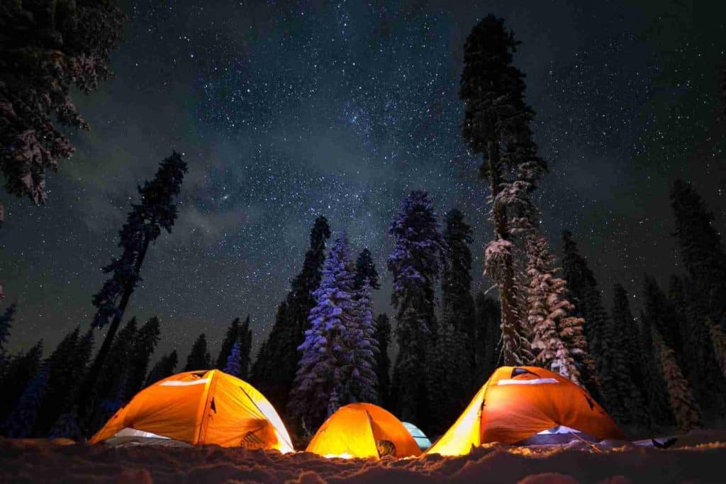 three tents under stars - family camping