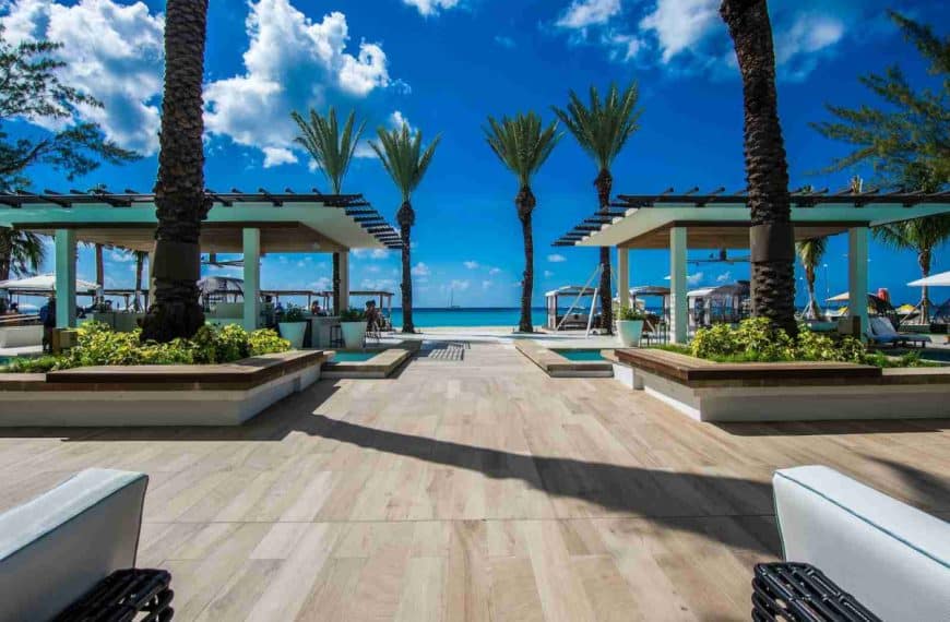 landscape photography of two pergolas near body of water
