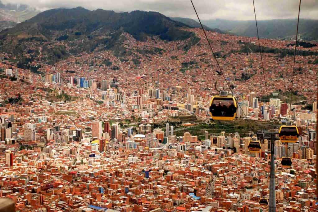 four running cable cars during daytime