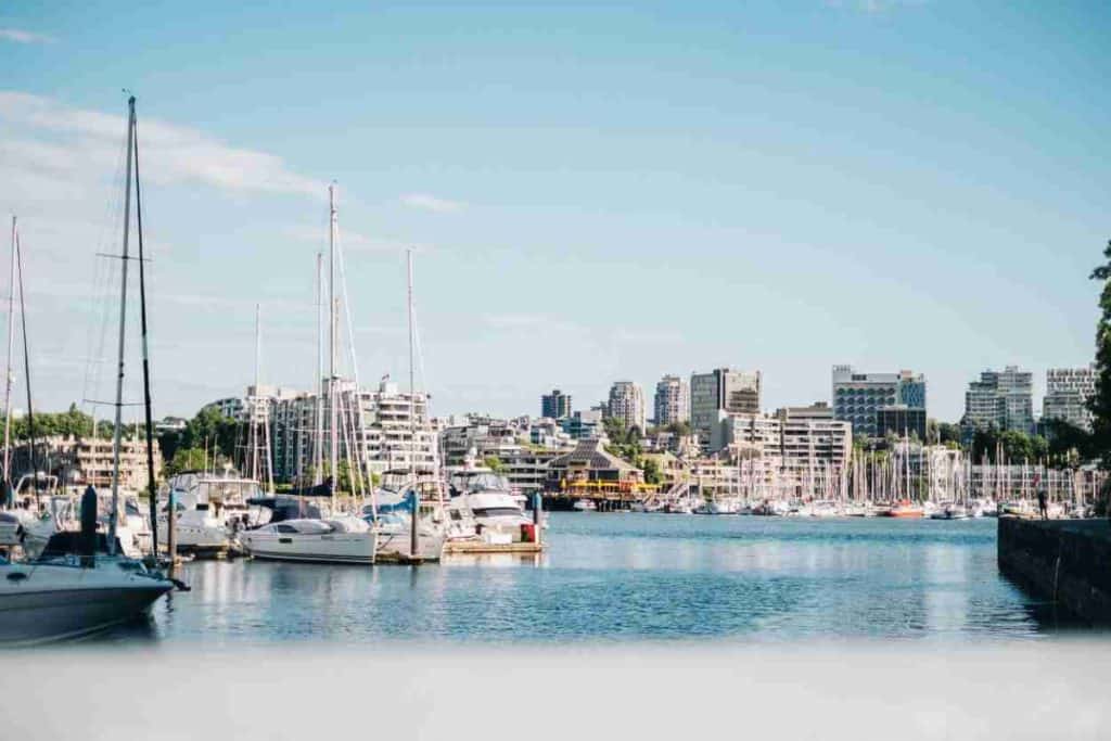 City buildings and boats along the water in Vancouver, BC