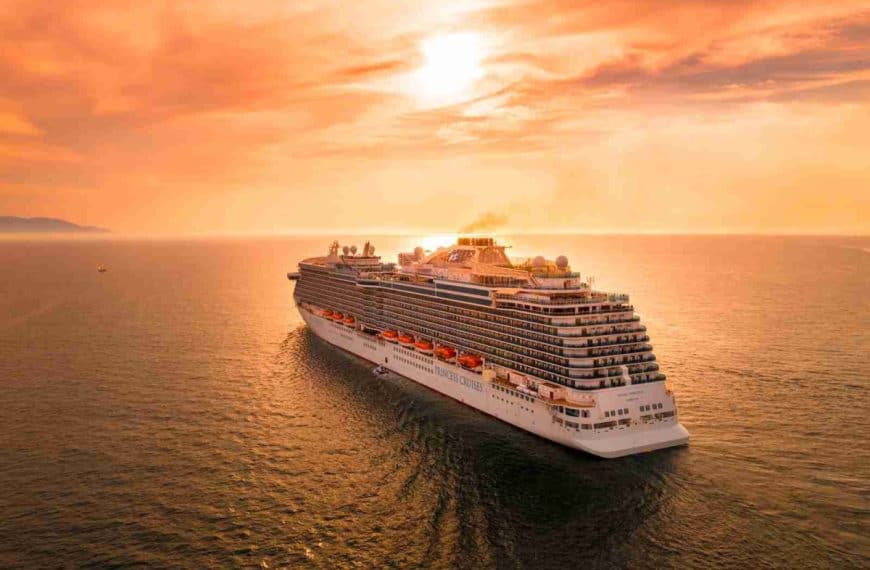 white ship on sea during sunset
