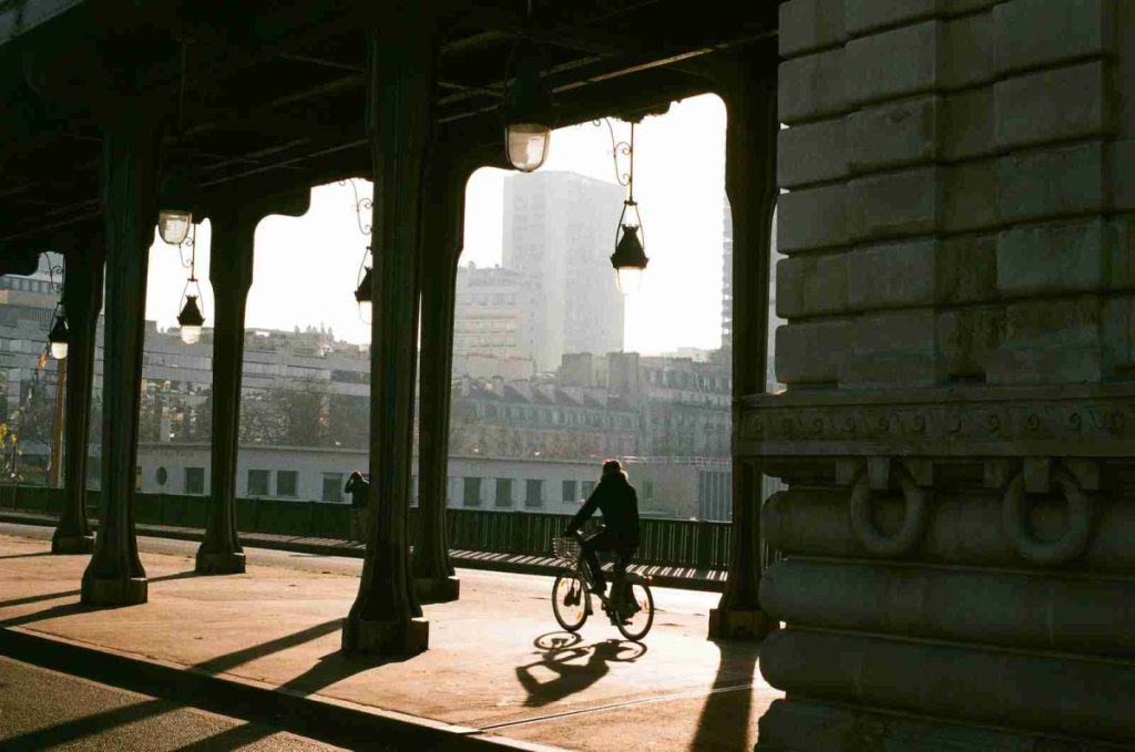 Person riding an electric bicycle in a city