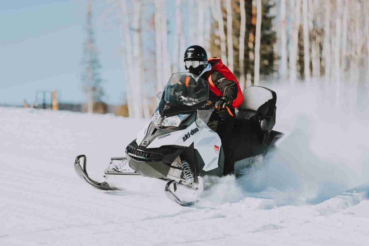 unique winter adventures in national parks - snowmobiling in Yellowstone National Park