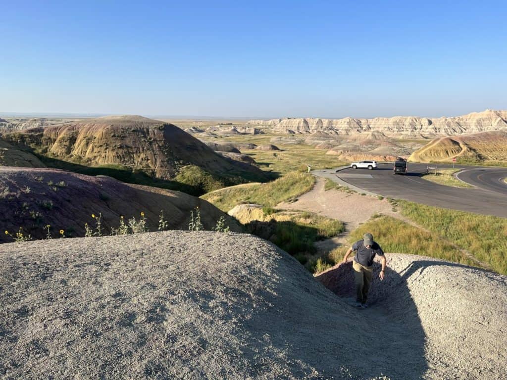 Climbing a mound in the Badlands.