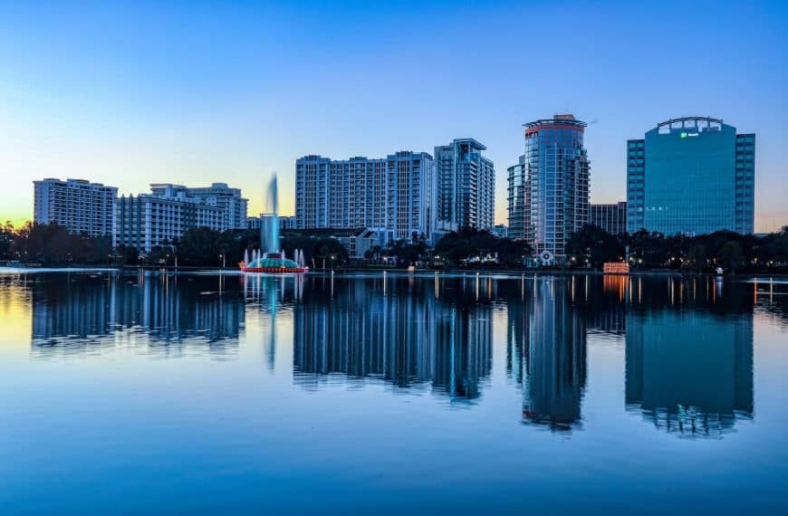 city skyline across body of water during daytime