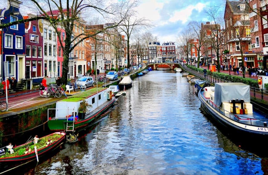 boat on river near buildings during daytime