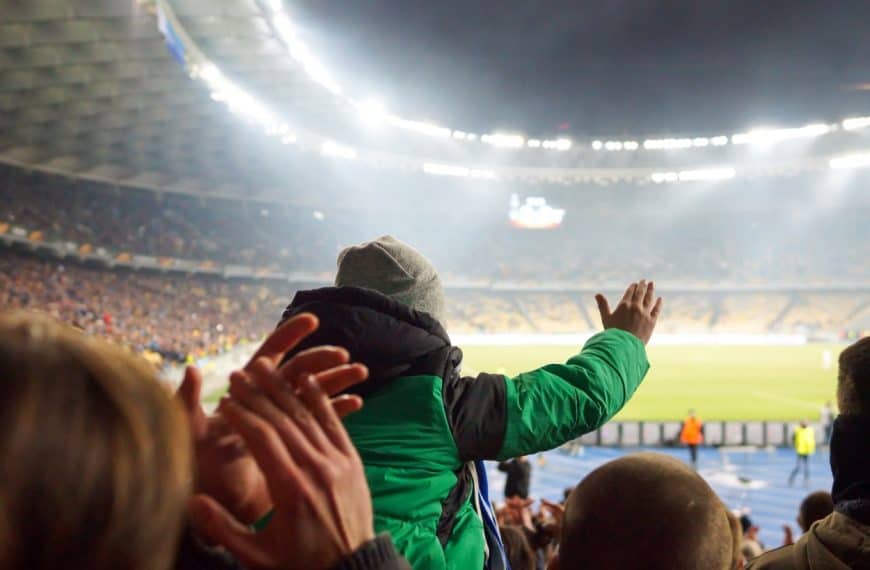 Fans cheering at a football game
