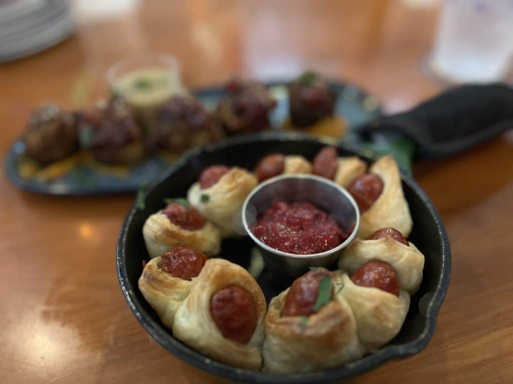 Disney Springs Hangar Bar menu at Christmas - pigs in a blanket