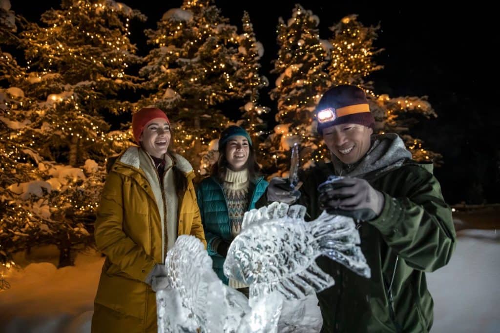 Guests look at an ice sculpture at SnowDays