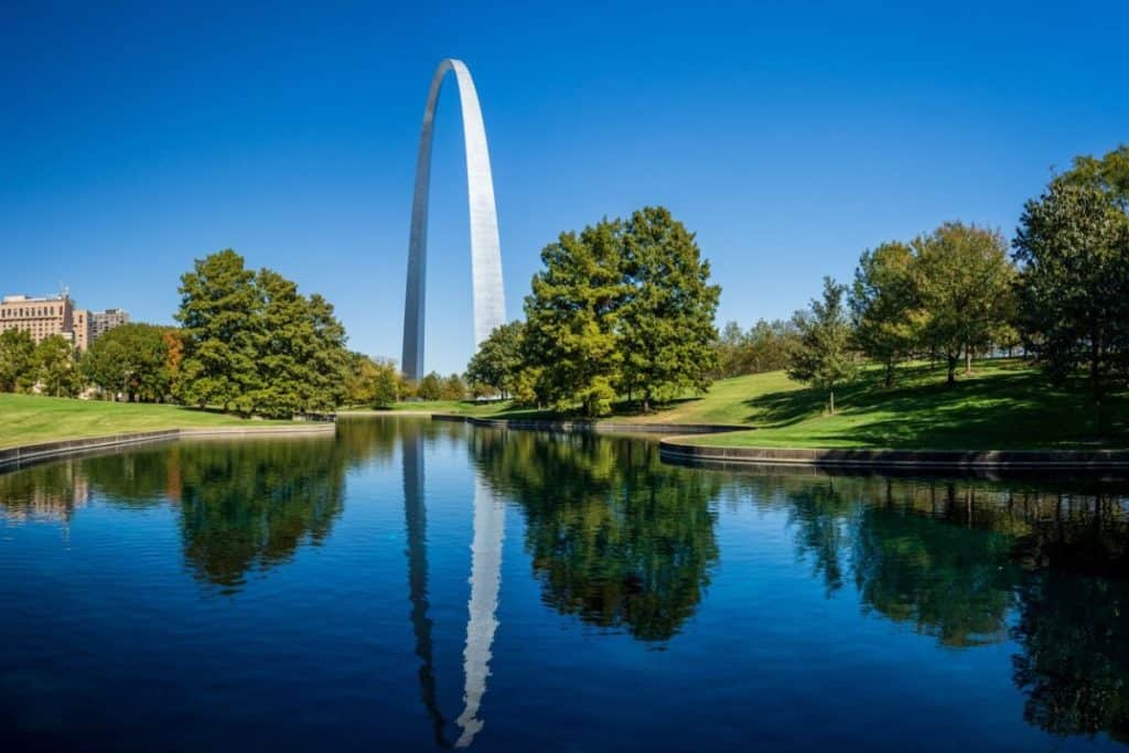 Reflection of the Gateway Arch in the water in St. Louis, MO