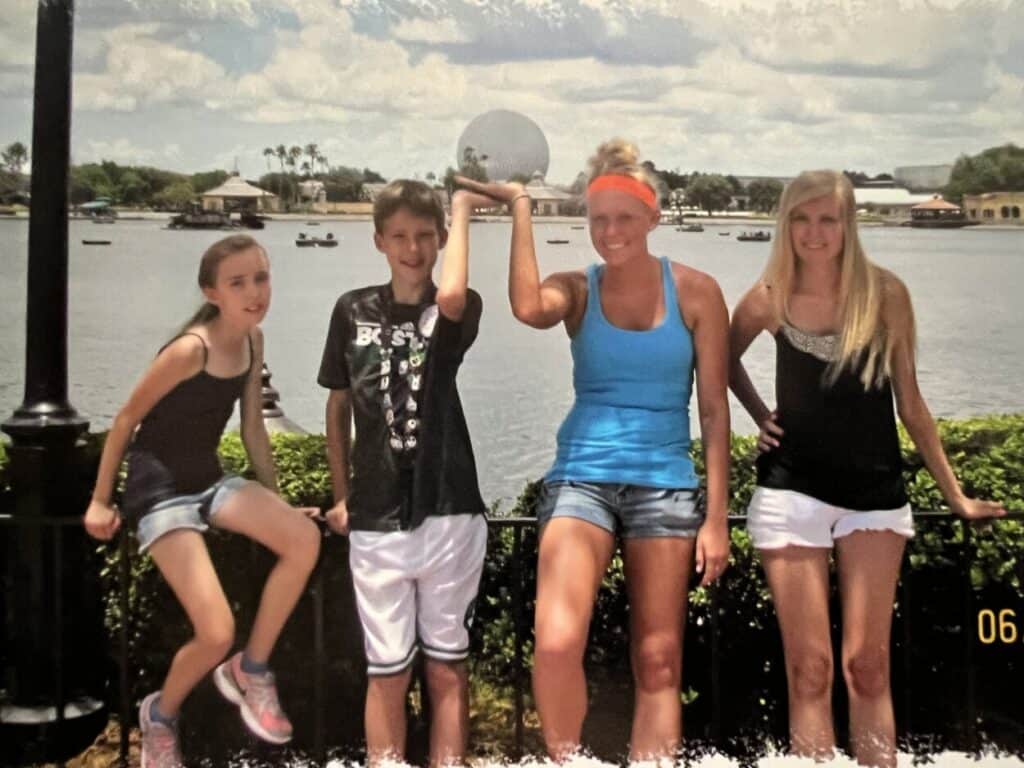 The Miles with McConkey kids pose for a photo in EPCOT