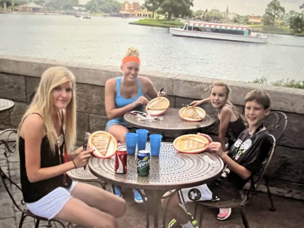 The Miles with McConkey kids eating crepes in EPCOT