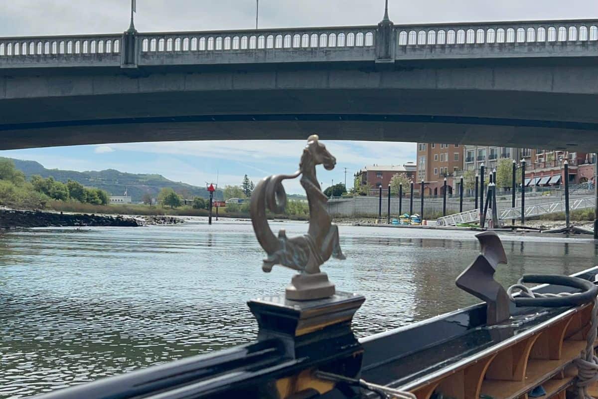 A gondola goes under a bridge in Downtown Napa.