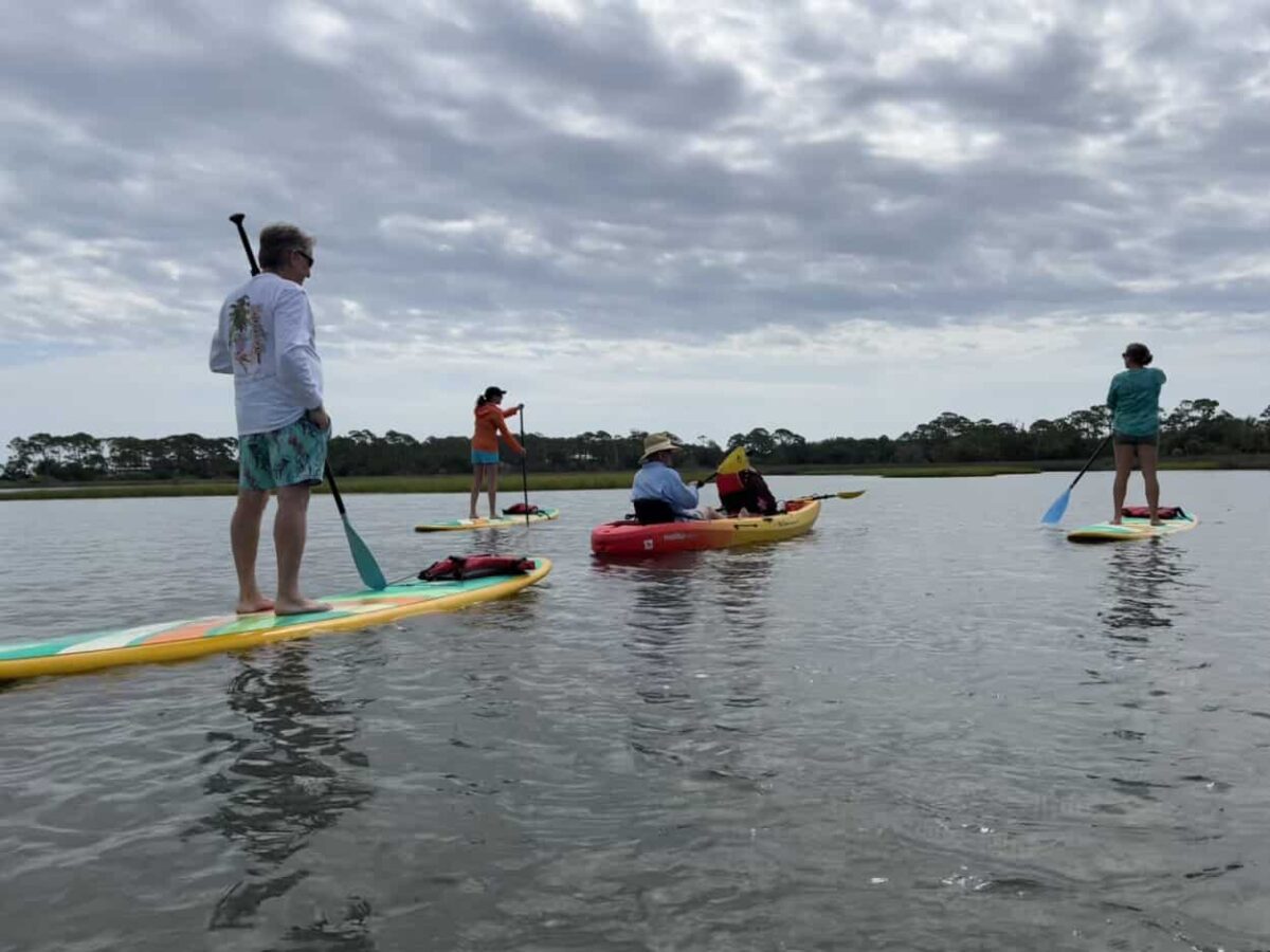 St. George Island guests enjoy kayaking and paddleboarding.