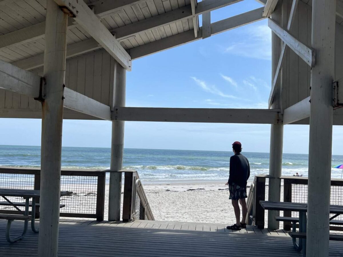 Scott McConkey of the Miles with McConkey Travel Blog looks at the beach from a picnic shelter in St. George Island State Park.