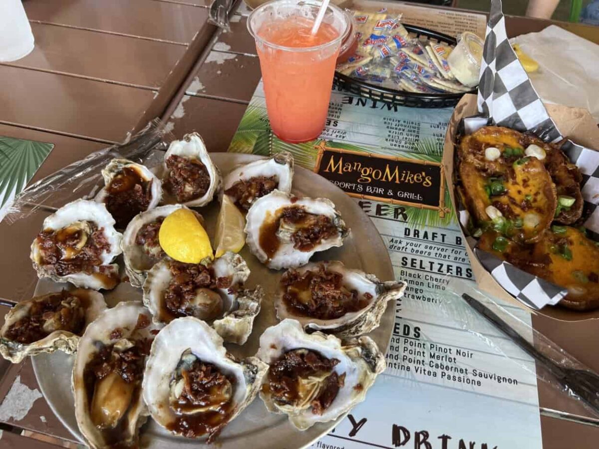 Oysters, potato wedges, and a cocktail at Mango Mike's in St. George Island.