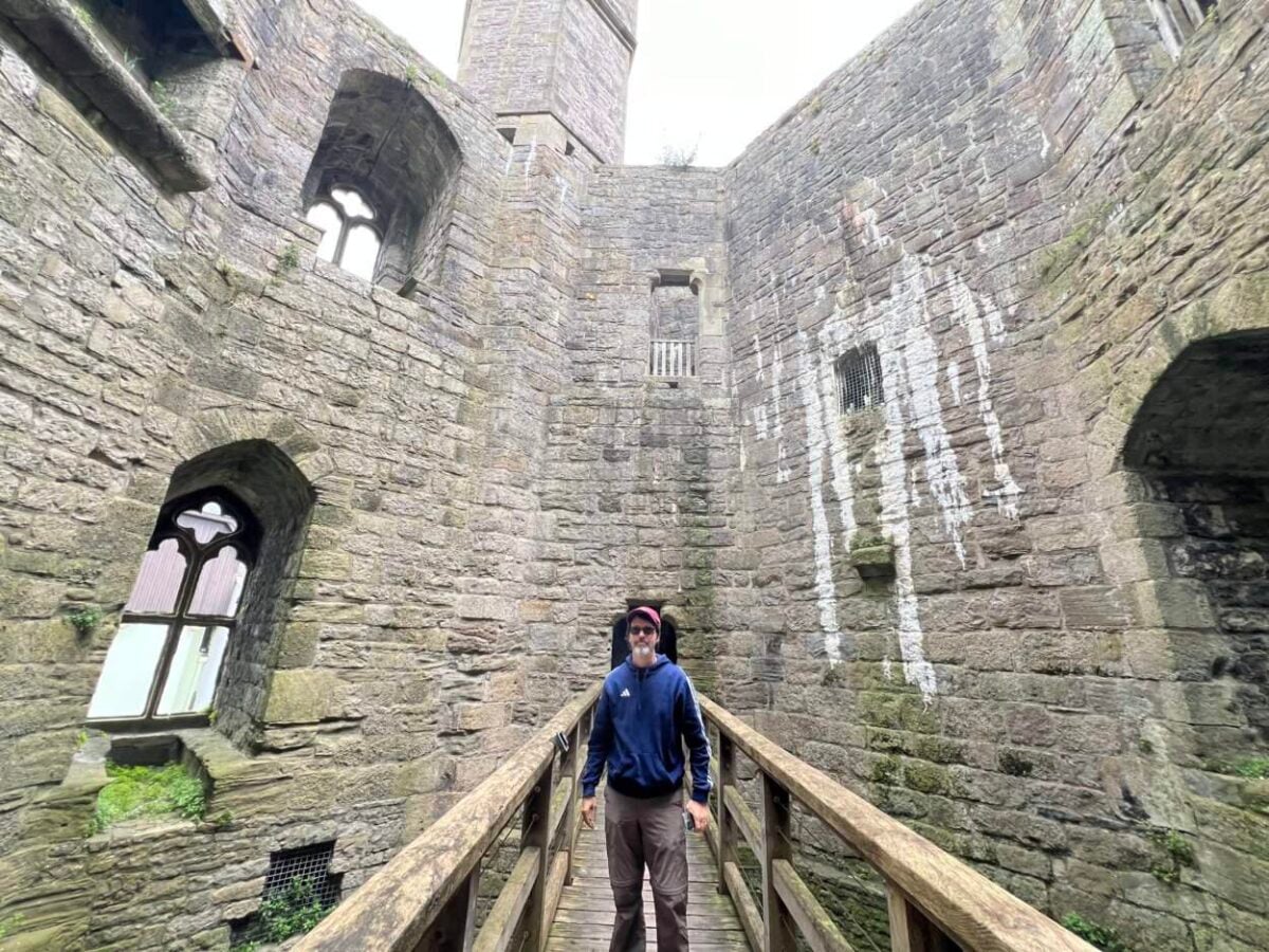 Scott McConkey, travel writer and founder of the Miles with McConkey Travel Blog, tours Caernarfon Castle in Wales.