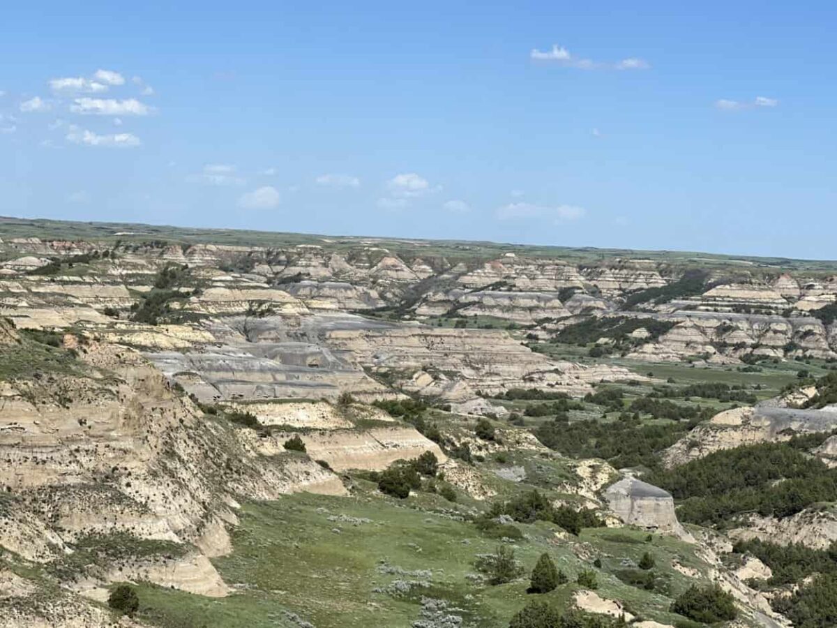 Badlands with bluish stripes from bentonite clay in Theodore Roosevelt National Park.