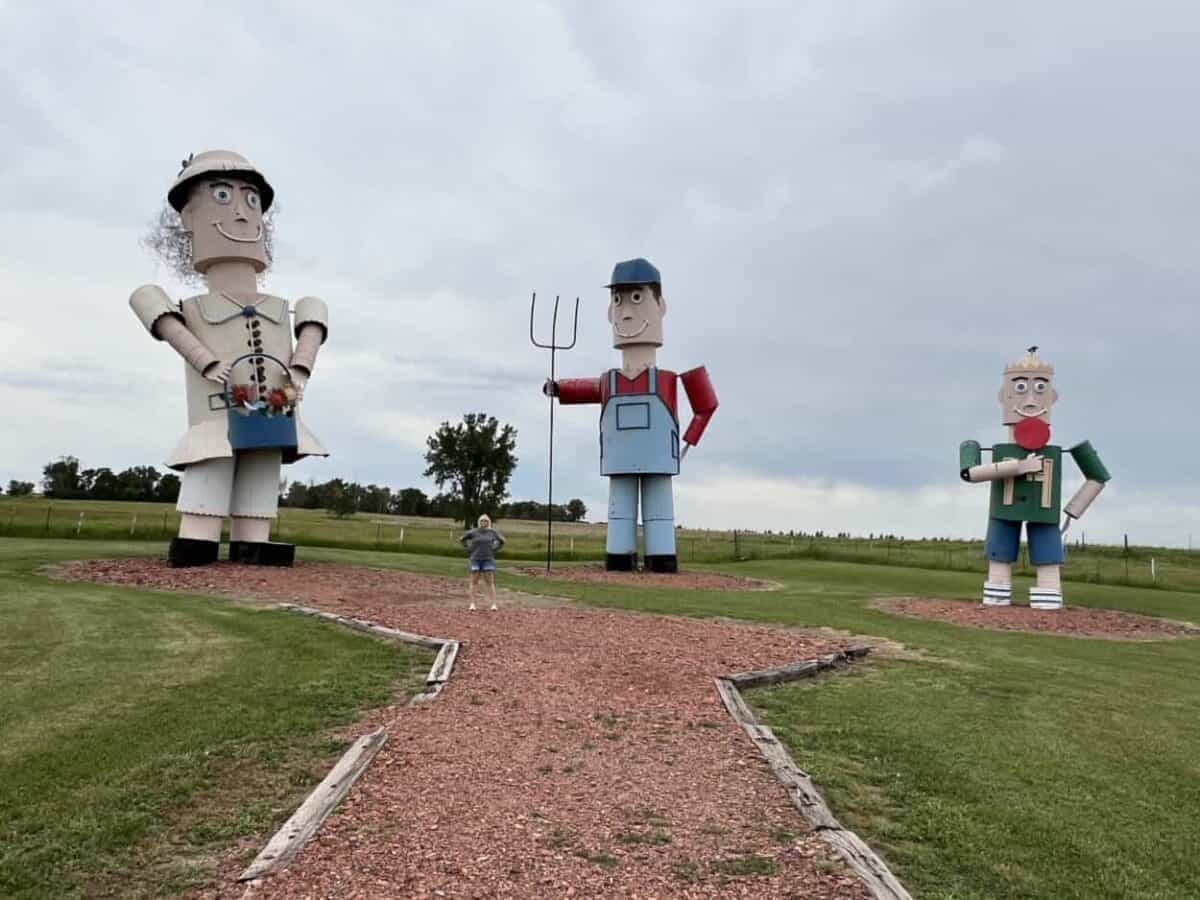 Roadside attraction in North Dakota with tall metal figures of a father, mother, and son