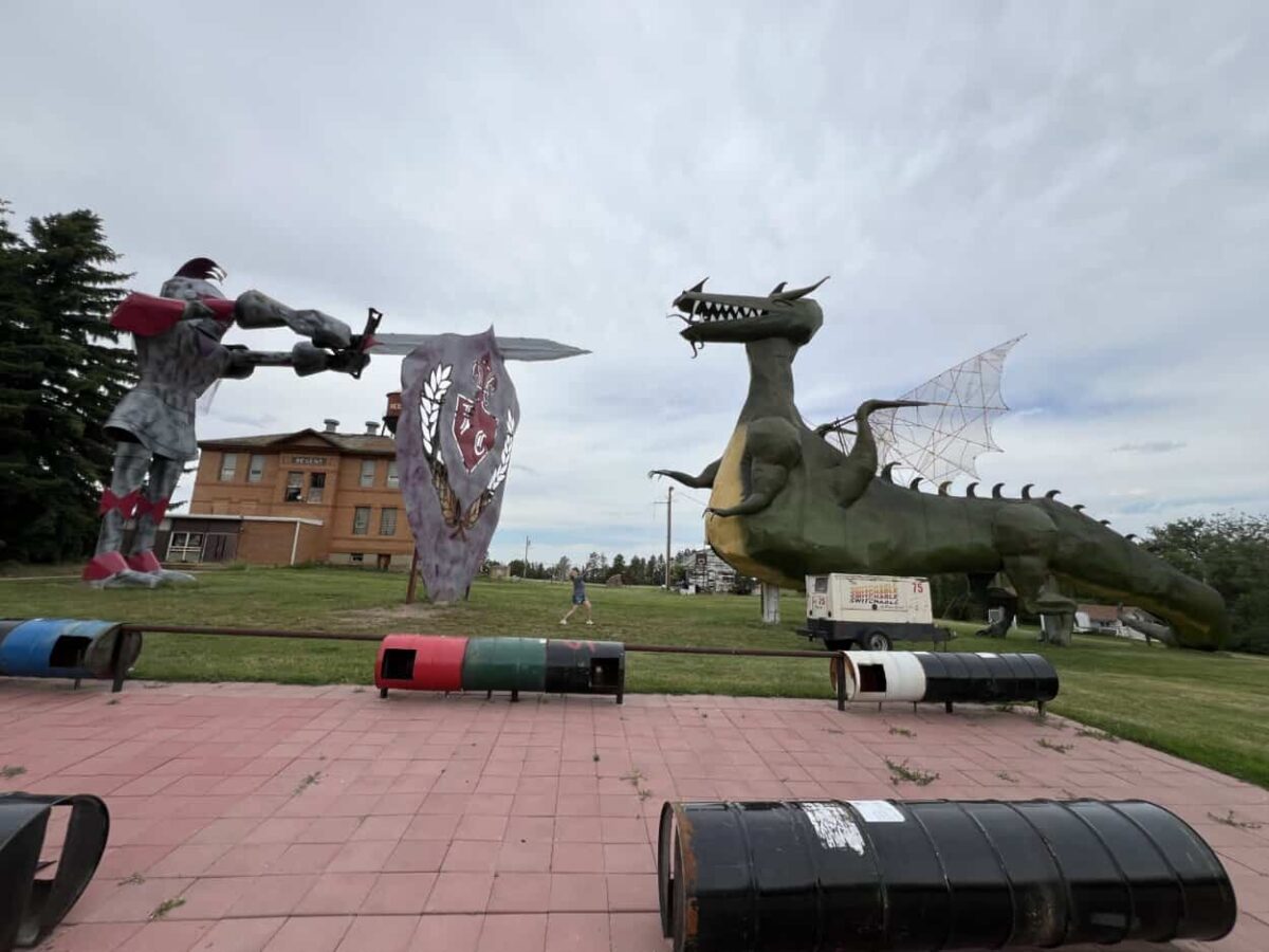 Roadside attraction in North Dakota of a knight using a sword to fight a green dragon