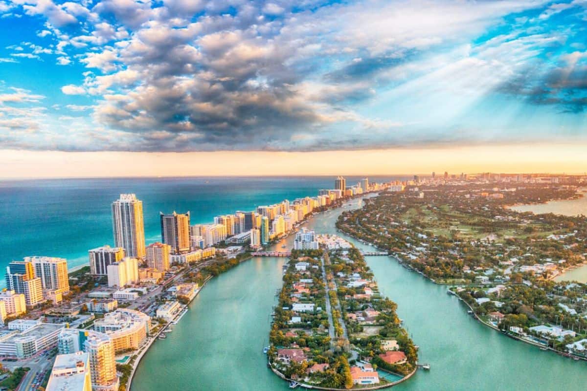 Sun rays filter through the clouds over Miami Beach
