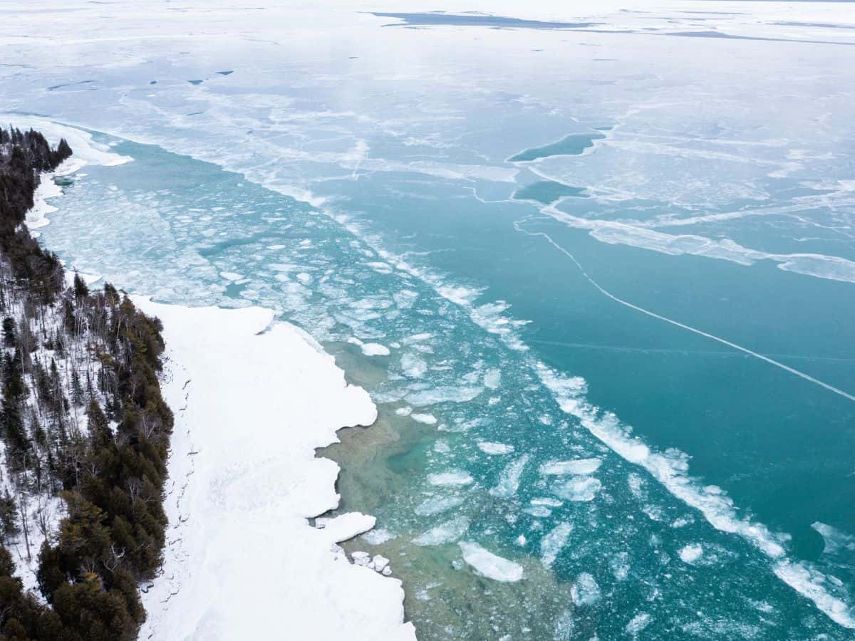 Ice forms in lake along shores of Whitefish Dunes State Park in winter