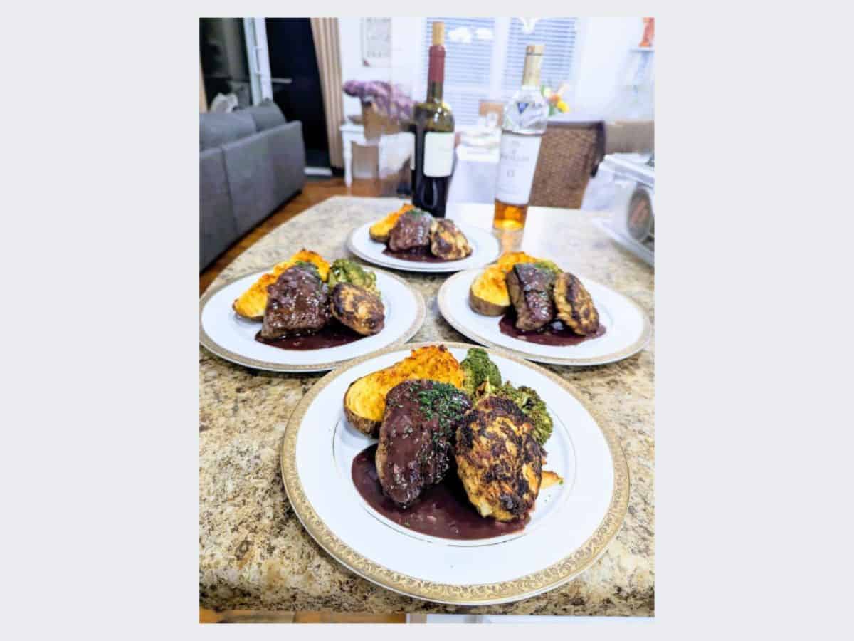Four dinner plates set on a table