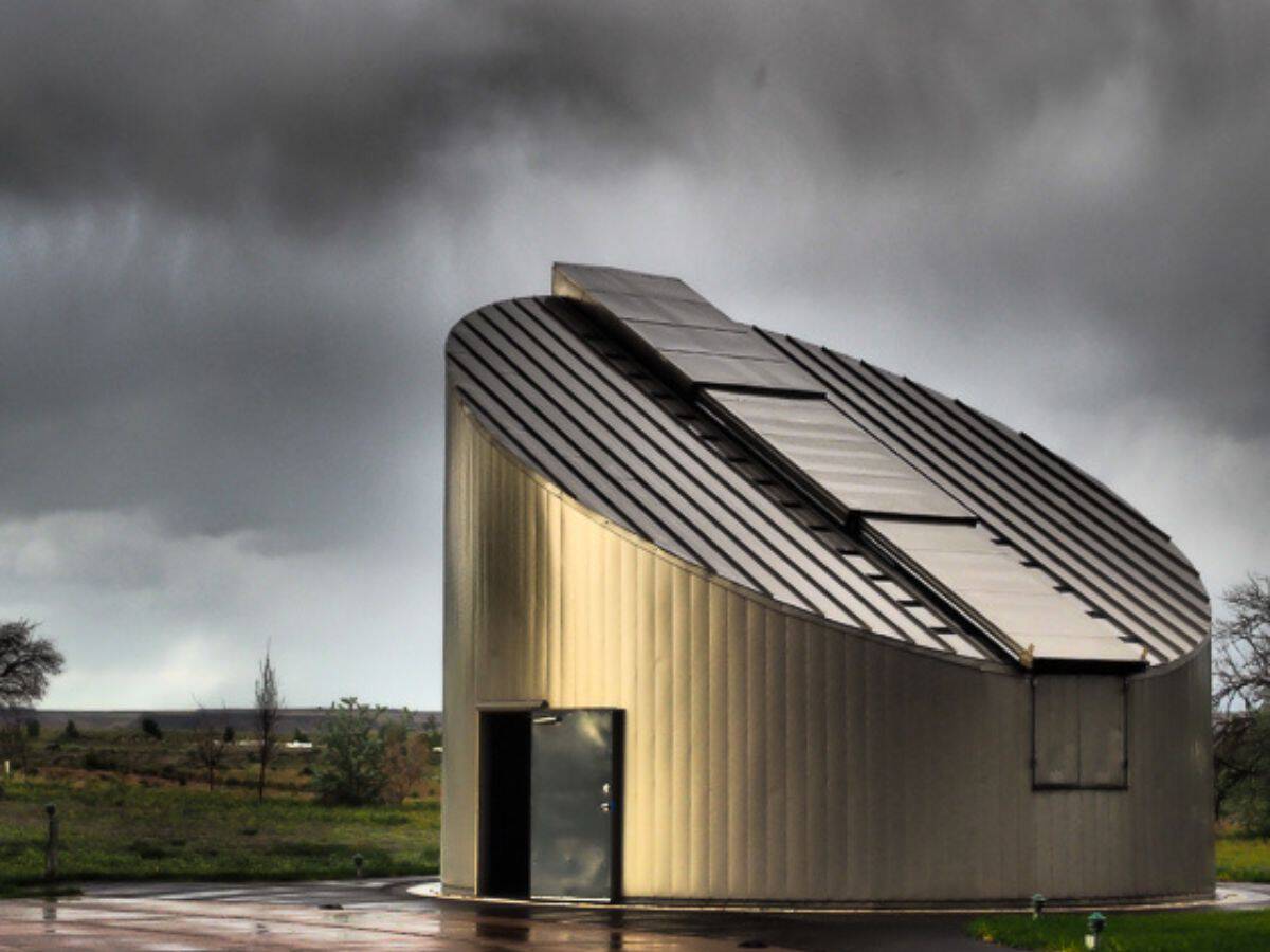 A cloudy sky looms over an observatory
