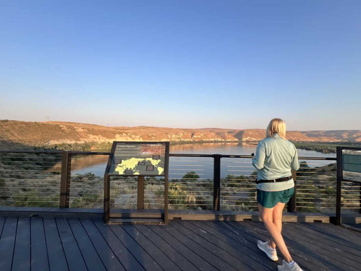 A woman walks to the edge of a viewing platform at Hagerman Fossil Beds National Monument, Idaho.