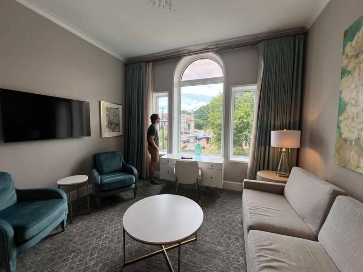Scott McConkey, travel writer and founder of the Miles with McConkey Travel Blog, looks out of his hotel window in the Rowland Hotel, Salem, VA