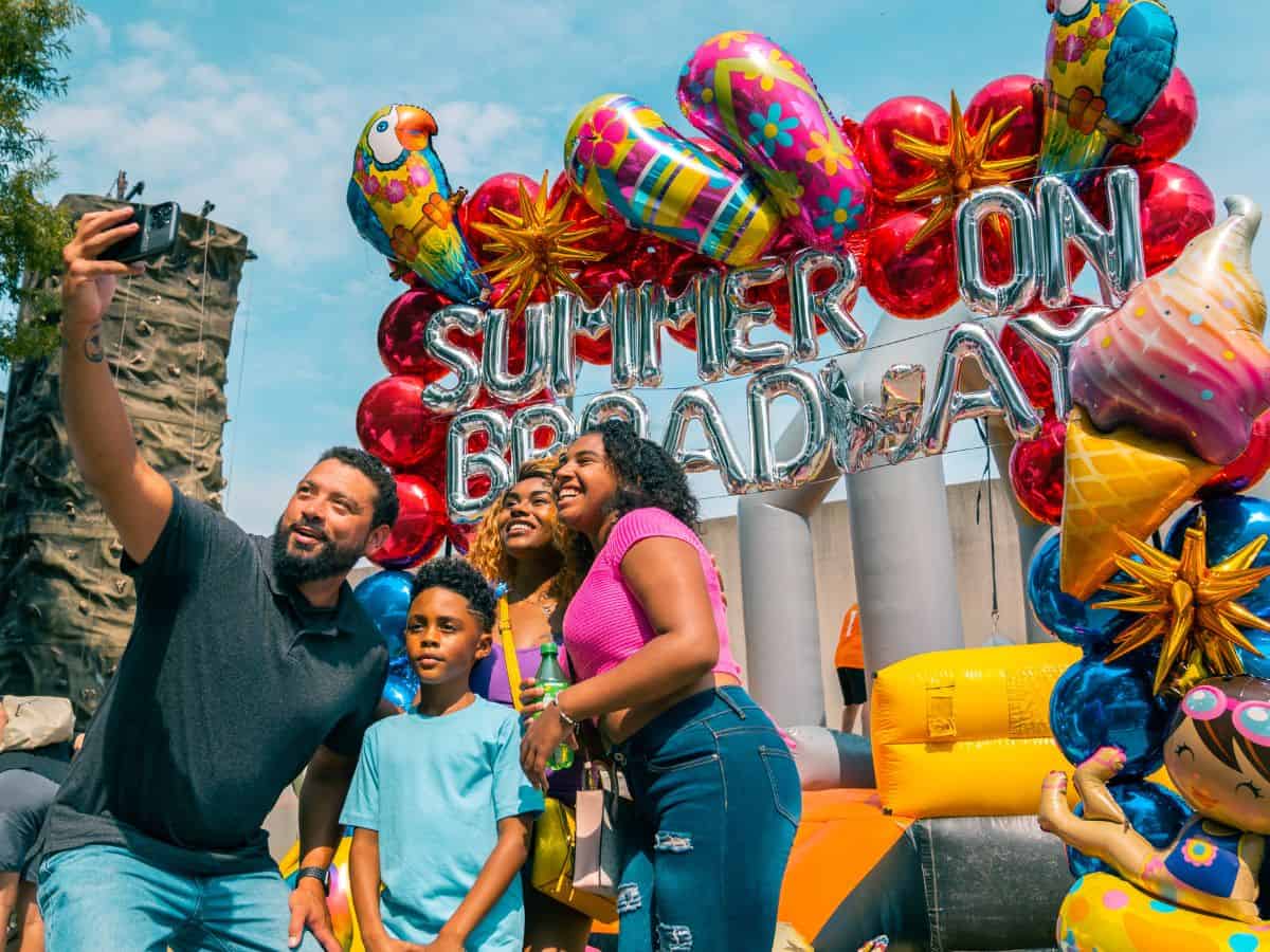 A family poses for a selfie at Summer on Broadway, a Smoky Mountain festival in Tennessee