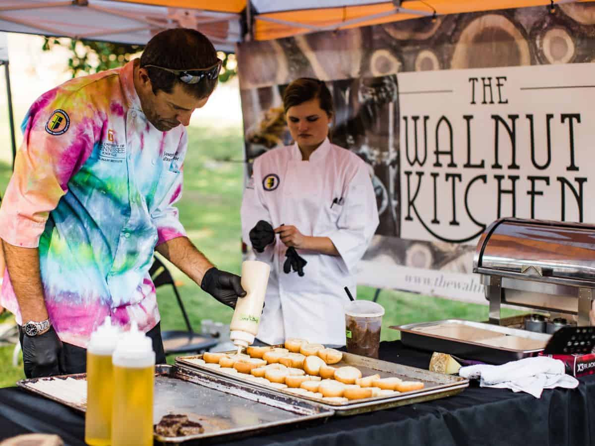 Two chefs prepare food for the Taste of Blount festival in Tennessee