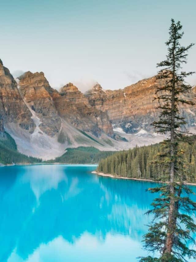 a blue lake surrounded by mountains and trees