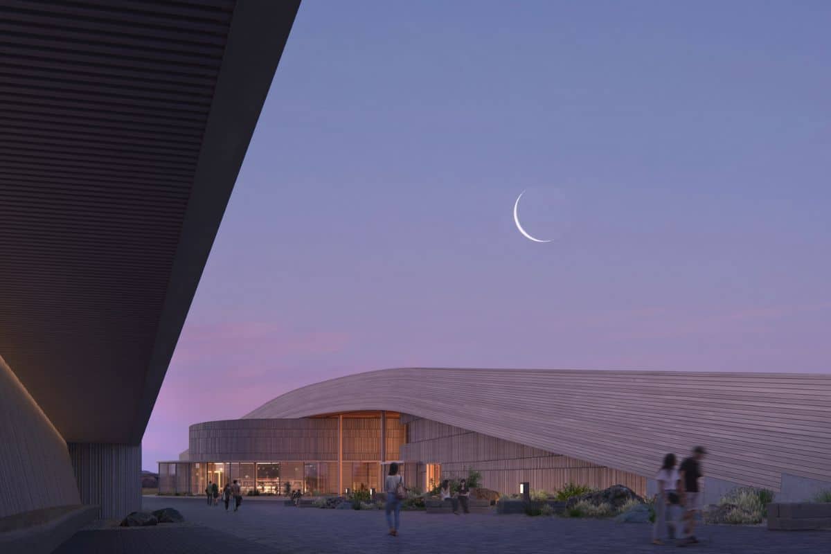 A crescent moon shines over the Theodore Roosevelt Presidential Library