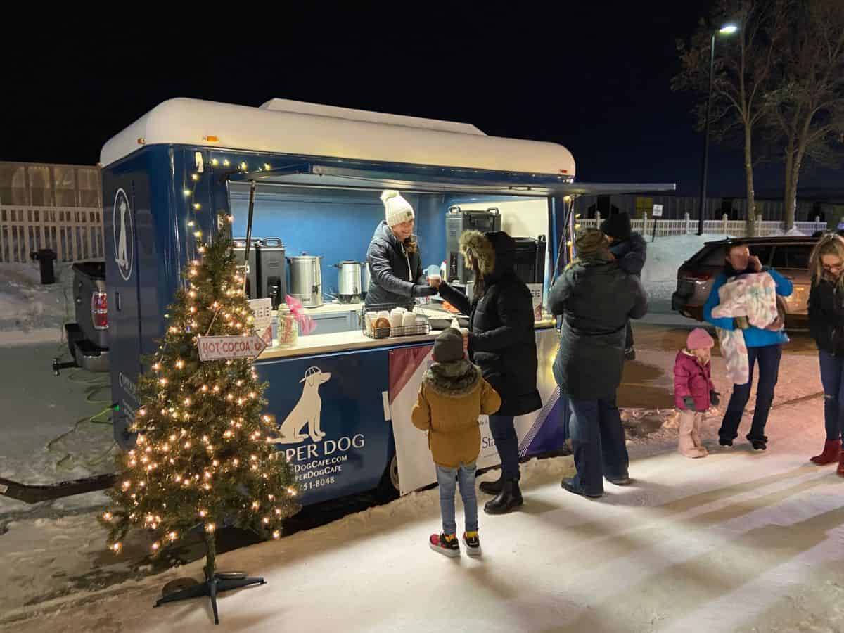 The Copper Dog Cafe mobile food truck serves customers in winter.