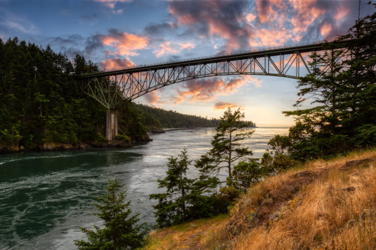 Pink clouds hover over the Deception Pass bridge in WA