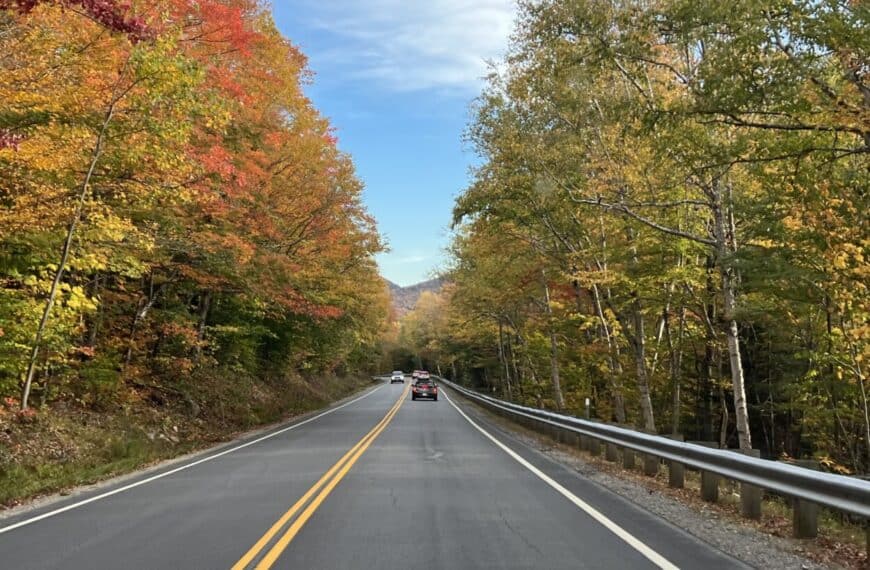 Cars drive on the Kancamagus Highway, NH.