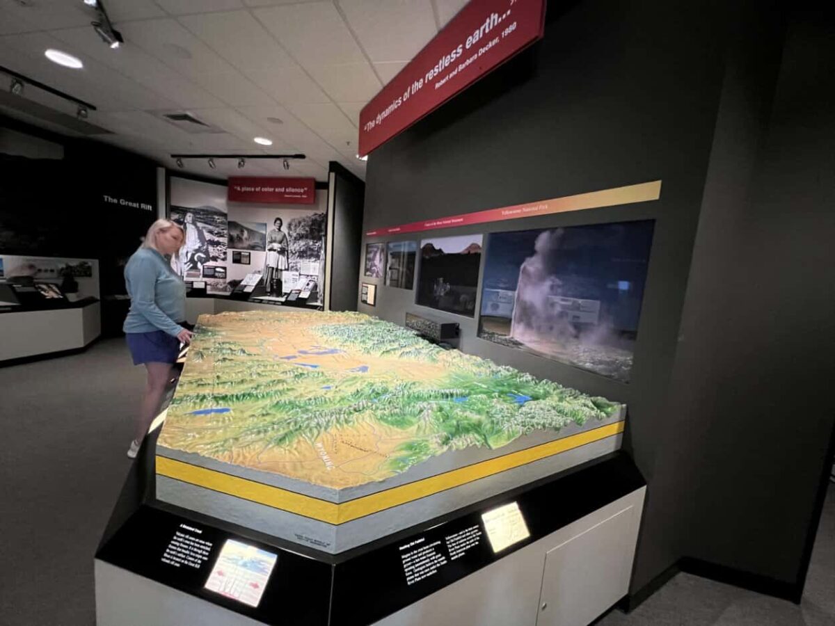 A woman looks at a large map exhibit in the Craters of the Moon visitor center