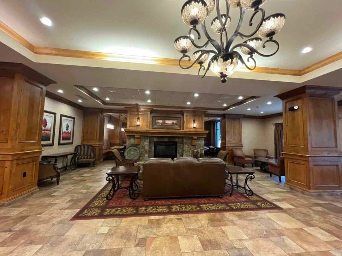 A couch sits in front of a fireplace in the lobby of the La Quinta Inn & Suites, Twin Falls, Idaho.