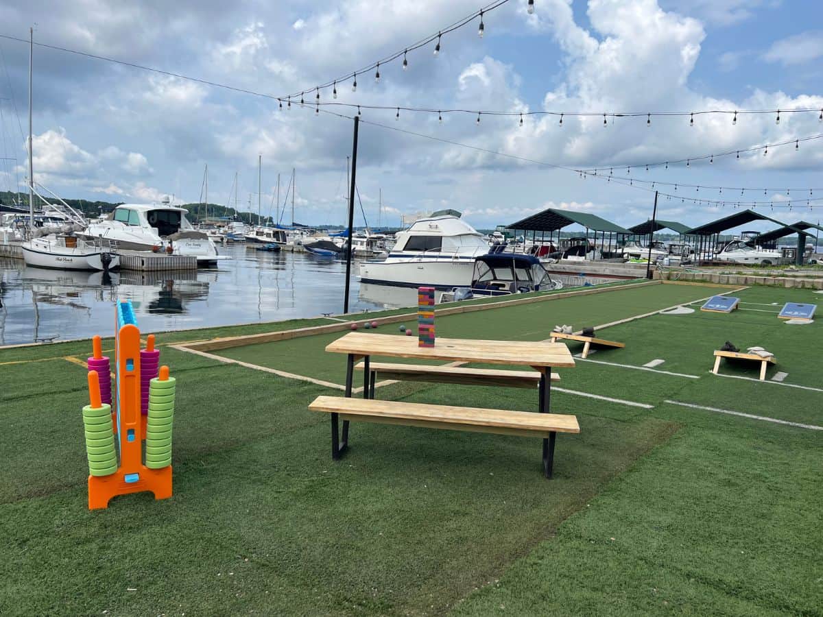 A gaming area at a 1000 Islands restaurant overlooks boats on the bay.