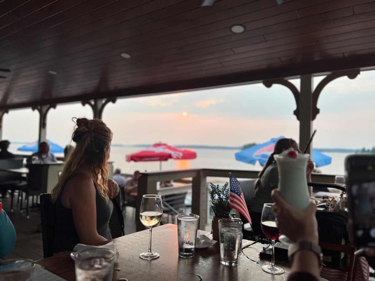 Customers enjoy drinks and the view at Channelside Restaurant in 1000 Islands, NY.