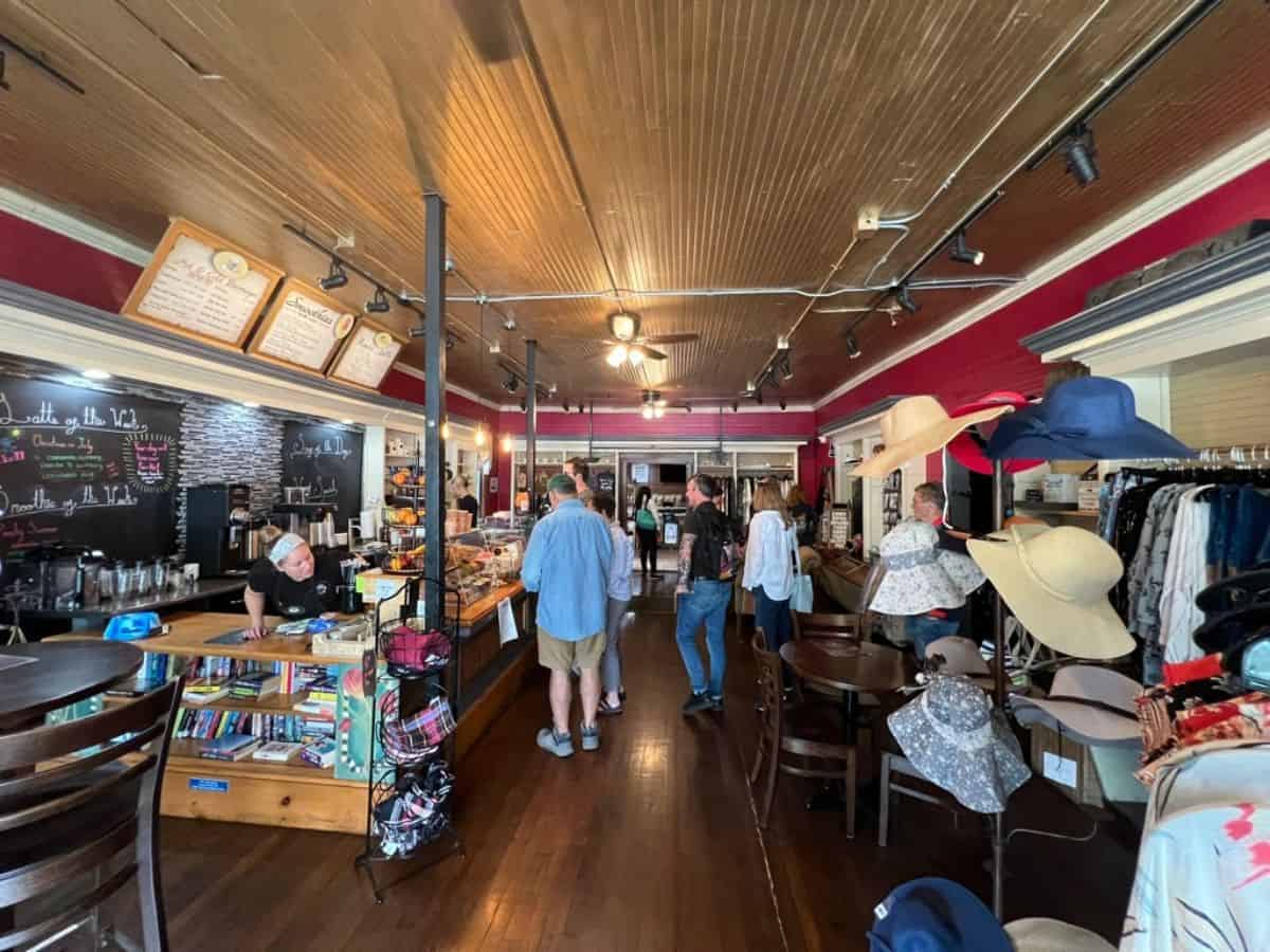 Customers wait for their orders in a coffee shop.